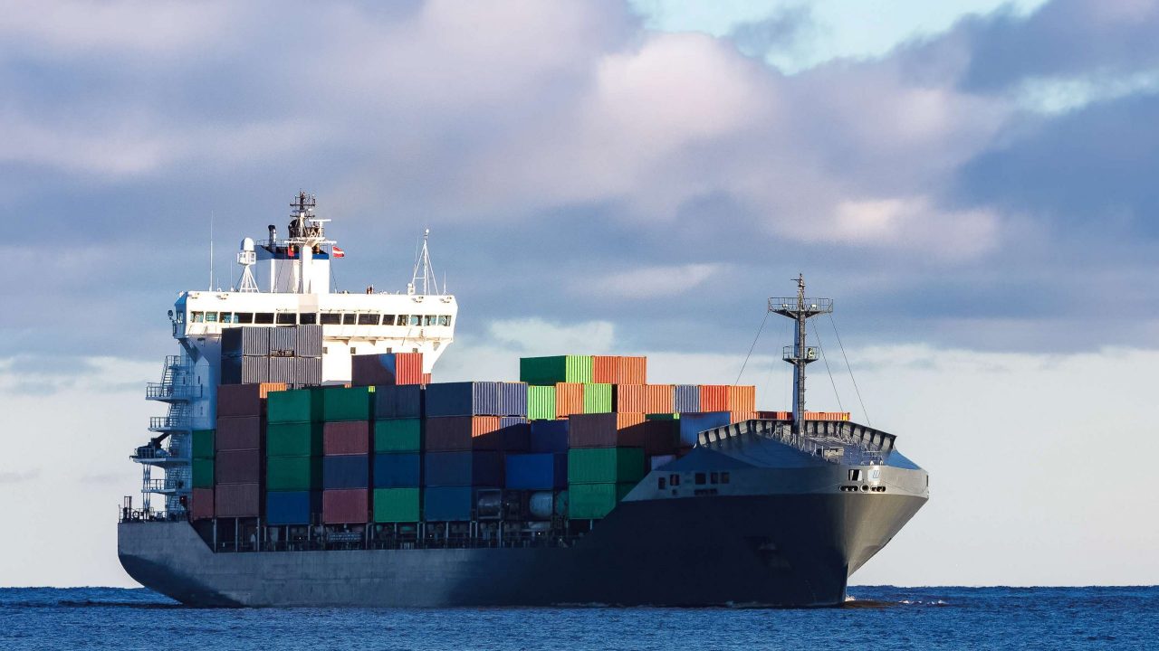 modern-grey-container-ship-moving-still-water modern-grey-container-ship-moving-still-water